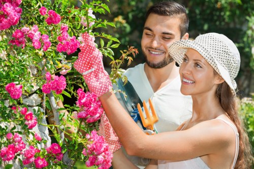 Photograph of a gardener inspecting a complaint issue on a residential lawn